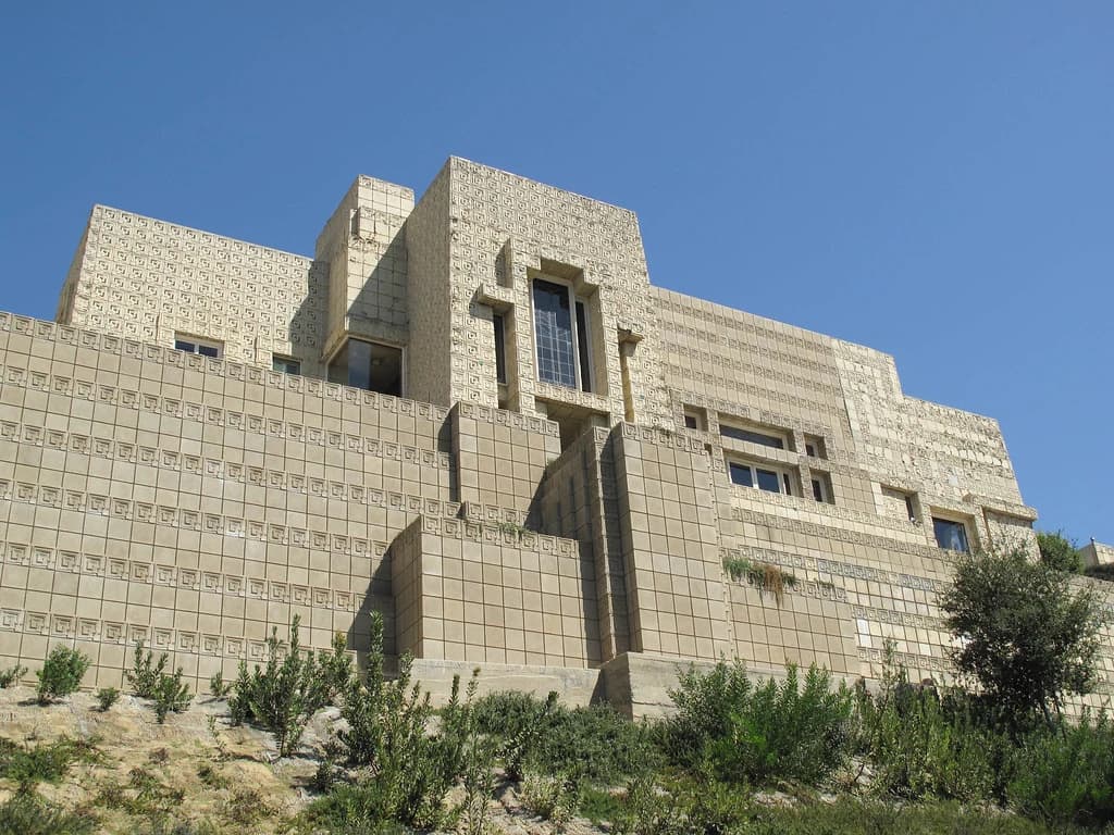 Textile-block facade of the Ennis House beneath a clear blue sky