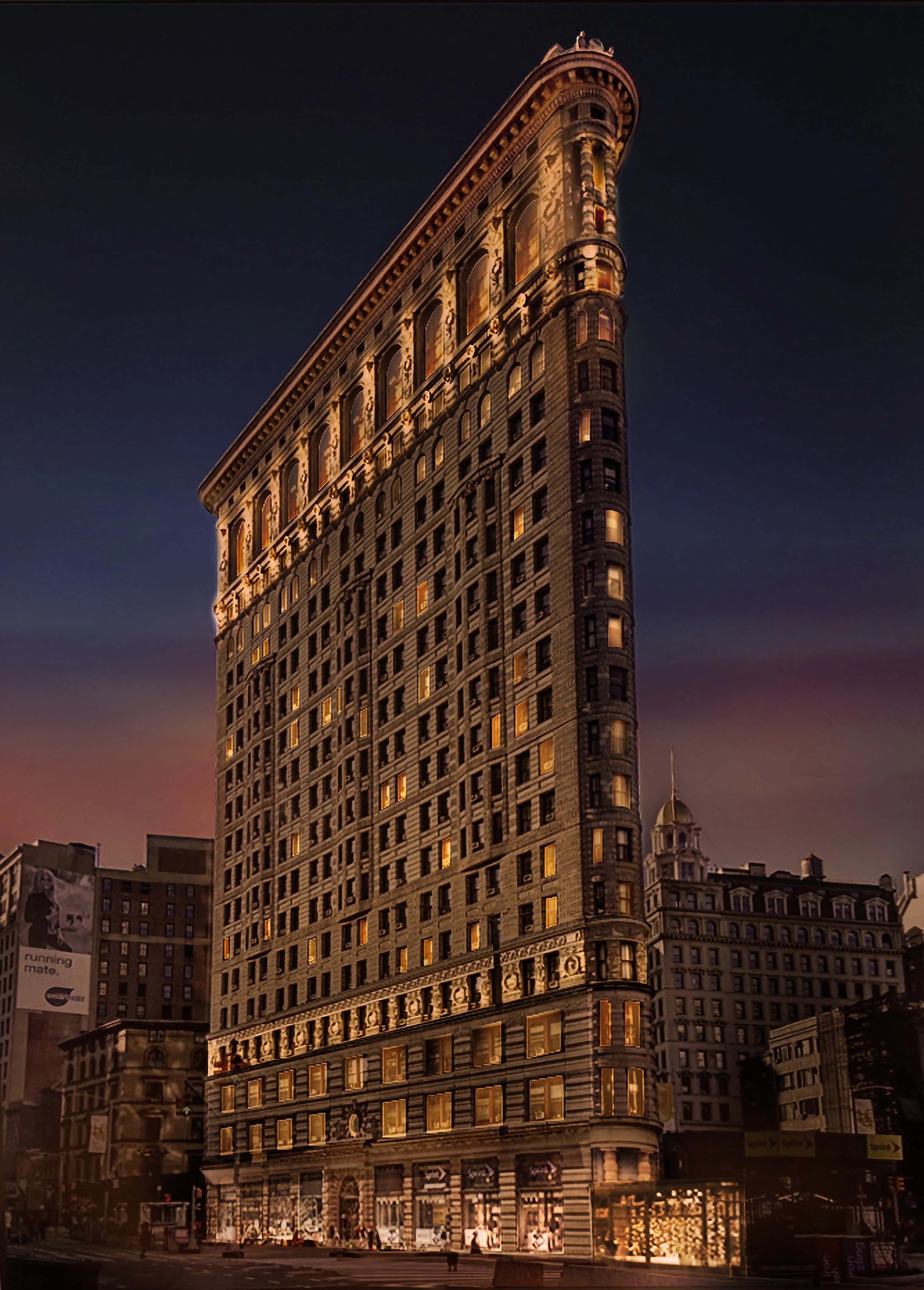 Flatiron Building lit against the night sky