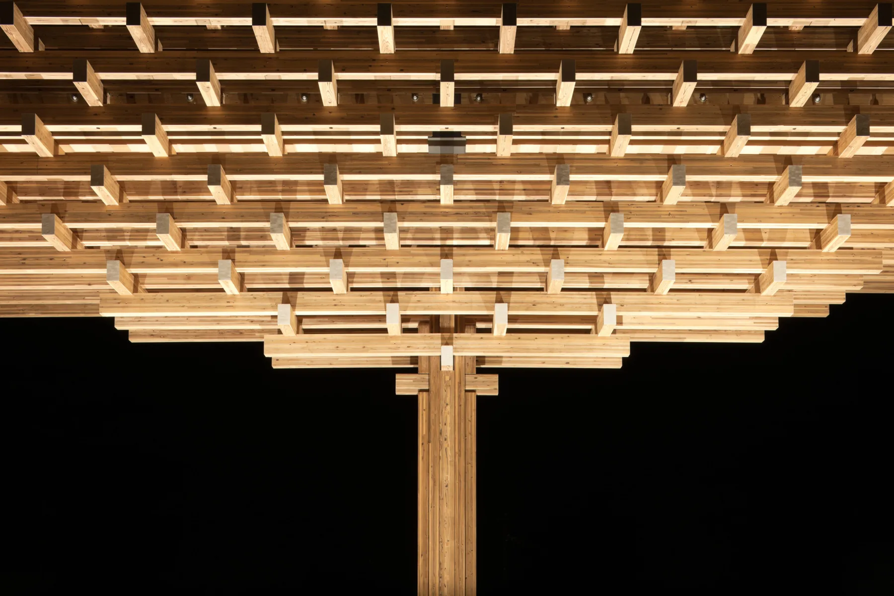 Timber cantilever structure of the Yusuhara Wooden Bridge Museum at night